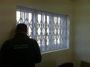locksmith fitting internal collapsible security grilles